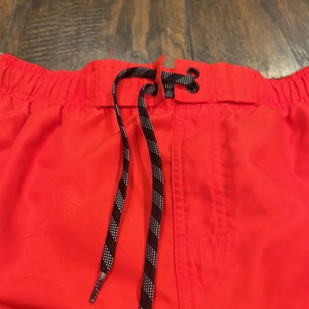 nike swim trunks size L red and black embroidered grey logo EUC with pockets